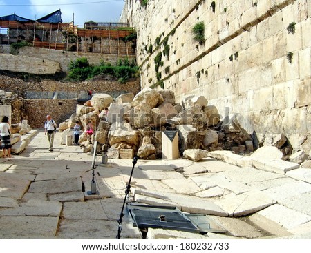 JERUSALEM, ISRAEL - JULY 15: Group of tourists at the ruins of the Second Temple, destroyed by Roman soldiers in the first century AD on Jyly 15, 2007 in Jerusalem, Israel