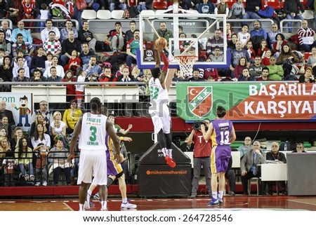 IZMIR  MARCH 21: Pinar Karsiyaka\'s KENNY KENNETH BENARD GABRIEL slam dunks in Turkish Basketball League game between Pinar Karsiyaka 66-71 Royal Hali Gaziantep on March 21, 2015 in Izmir