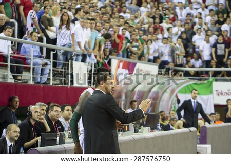 IZMIR - JUNE 06: Pinar Karsiyaka\'s Coach UFUK SARICA gives tactics to KENNETH BENARD GABRIEL in Turkish Basketball League game between Pinar Karsiyaka 82-64 Fenerbahce Ulker on June 06, 2015 in Izmir