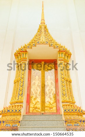 Stucco work, of the temple doors (Thailand style). (What about religion in Thailand is public).