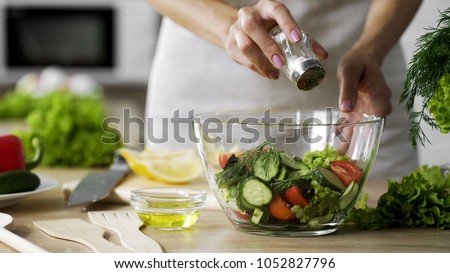 Similar – Image, Stock Photo Woman seasoning food with salt