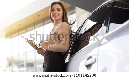 Image, Stock Photo Smiling businesswoman standing near gray wall