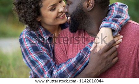 Similar – Image, Stock Photo Delicate multiethnic couple hugging under natural arch of flowers