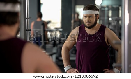 Similar – Image, Stock Photo Overweight male with mirror applying red lipstick