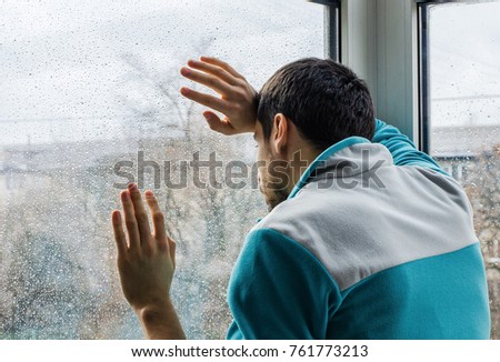 Similar – Image, Stock Photo Depressed man looking through window