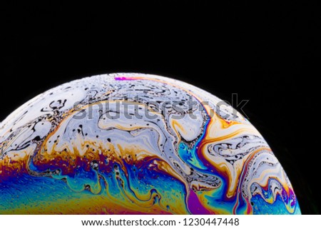 Similar – Image, Stock Photo The half soap bubble is reflected in the wet surface and in this way forms a whole again.