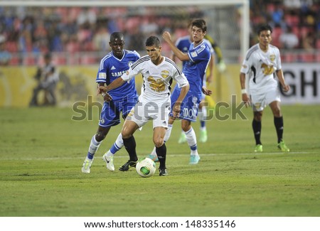 BANGKOK,THAILAND-JULY17:Cleiton Silva(L2) of Singha All-Star in action during the international friendly match Chelsea FC and Singha All-Star at the Rajamangala Stadium on July17,2013 in Thailand.