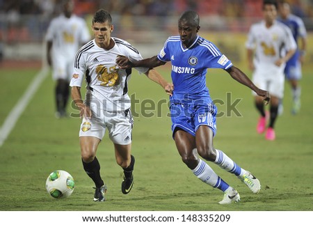 BANGKOK,THAILAND - JULY 17: Ramires(R) of Chelsea in action during the international friendly match Chelsea FC and Singha Thailand All-Star at the Rajamangala Stadium on July17,2013 in Thailand.
