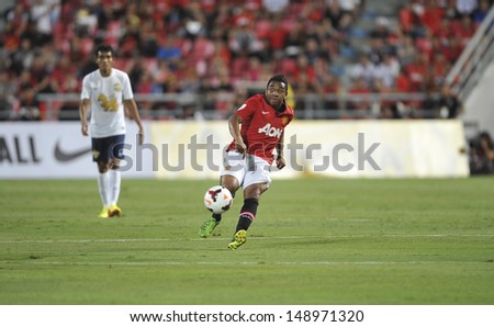 BANGKOK,THAILAND-JULY13: Anderson(R) of Manchester United in action during the friendly match between Singha All Star and Manchester United at Rajamangala Stadium on July 13, 2013 in Thailand.