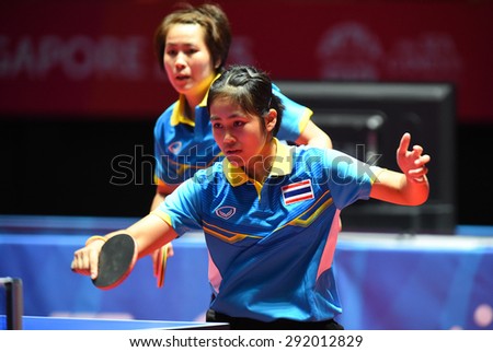 KALLANG,SINGAPORE-JUNE1:Suthasini.S and Nanthana.K of Thailand in action during the 28th SEA Games Singapore 2015 between Thailand and Indonesia at Singapore Indoor Stadium on June1 2015 in SINGAPORE.