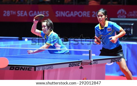 KALLANG,SINGAPORE-JUNE1:Nanthana.K and Suthasini.S of Thailand in action during the 28th SEA Games Singapore 2015 between Thailand and Indonesia at Singapore Indoor Stadium on June1 2015 in SINGAPORE.