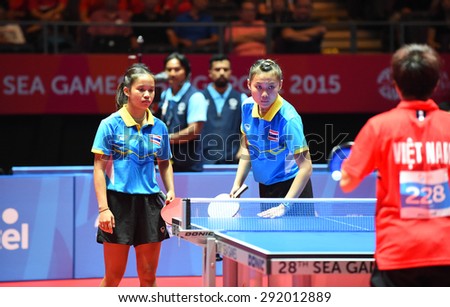 KALLANG,SINGAPORE-JUNE1:Tamolwan.K and Orawan.P of Thailand in action during the 28th SEA Games Singapore 2015 between Thailand and Vietnam at Singapore Indoor Stadium on June1 2015 in SINGAPORE.