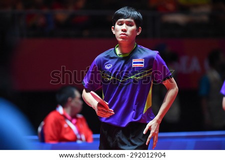 KALLANG,SINGAPORE-JUNE1:Nikom.W of Thailand in action during the 28th SEA Games Singapore 2015 between Thailand and Indonesia at Singapore Indoor Stadium on June1 2015 in SINGAPORE.