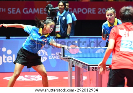 KALLANG,SINGAPORE-JUNE1:Orawan.P and Tamolwan.K of Thailand in action during the 28th SEA Games Singapore 2015 between Thailand and Vietnam at Singapore Indoor Stadium on June1 2015 in SINGAPORE.