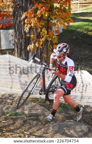 Louisville, Kentucky, Oct. 26, 2014 - Cyclist competes in the elite men\'s cyclocross race at Eva Bandman park.