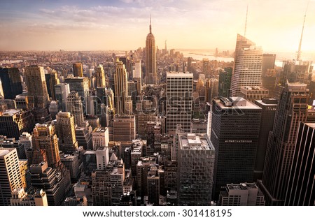 Photo of New York City skyline with urban skyscrapers at sunset, USA.