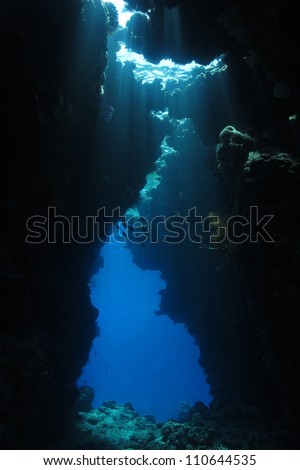 Game of lights inside the cave at Red Sea - underwater landscape