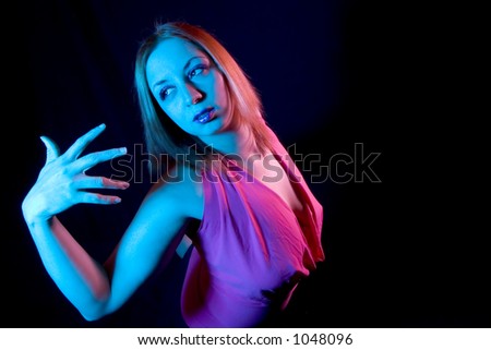 Woman in Pose shot with blue and pink filters and a wide angle lens
