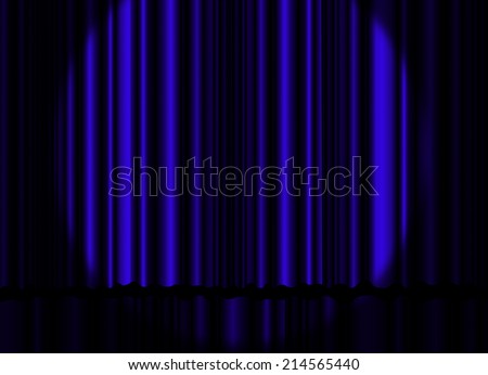Spotlight on blue stage curtain.