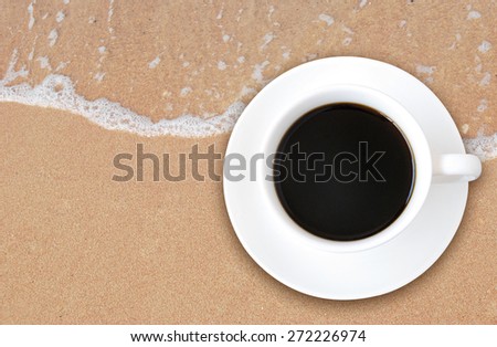 Hot coffee on sand beach background, outdoor style