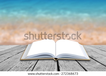 Open book with sea beach background