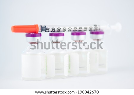 Injection vial and disposable syringe show medicine concept