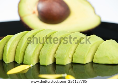 Avocado fruit on black floor
