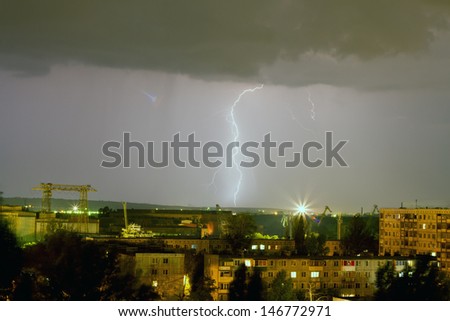 Storm over the city. Lightning flashed