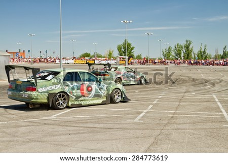 VOLGOGRAD - JUNE 6: Drift cars team X-Round enters the bend with slip during demonstrations as part of the tour on cities of Russia \