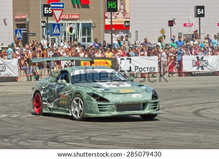 VOLGOGRAD - JUNE 6: Specially designed for drifting machine stylized military themes during a speech at the auto show. June 6, 2015 in Volgograd, Russia.