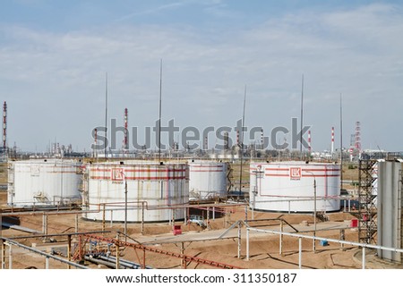 VOLGOGRAD, RUSSIA - AUGUST 28: Huge storage tanks for petroleum products with the logo of LUKOIL on the background of a large refinery . August 28, 2015 in Volgograd, Russia.