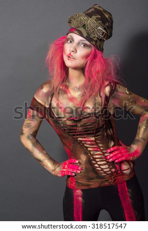 photos of girls in body art image with pink hair on a dark background