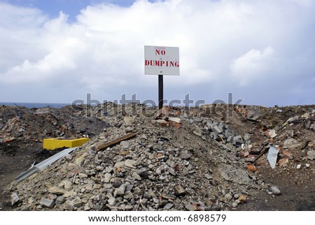 No dumping sign on a dump