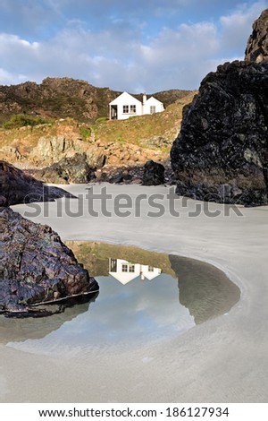 Kynance Cove is a cove in southwest Cornwall, United Kingdom being situated on the Lizard peninsula approximately two miles (3 km) north of Lizard Point.