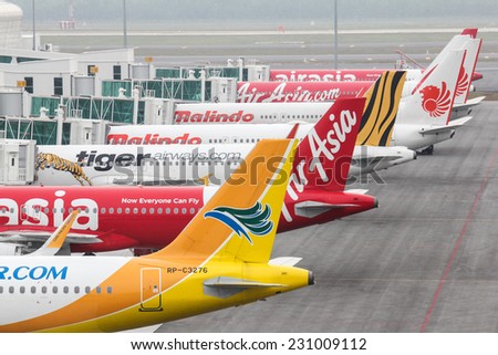 KUALA LUMPUR, MALAYSIA - OCTOBER 19, 2014 : A fleet of  budget airliners at the newly built airport of KLIA2.