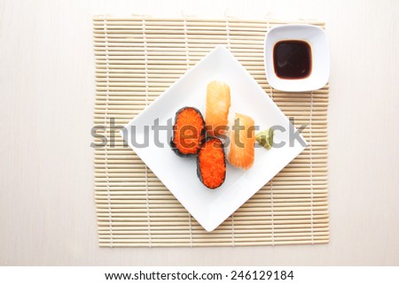 Salmon and flying fish roe sushi on plate
