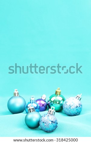 Blue Christmas tree ornaments on blue background