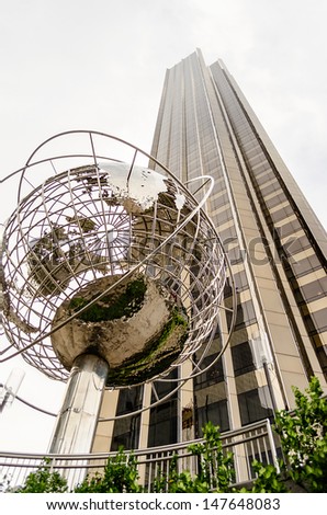 NEW YORK - CIRCA MAY 2013: The Globe and the Trump Hotel and Tower at Columbus Circle in NYC, circa May 2013. This major landmark is the point from which all official distances from NYC are measured.