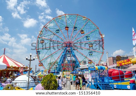CONEY ISLAND - MAY 30: The famous Wonder Wheel in Coney Island, May 30, 2013. The Eccentric Ferris Wheel was built in 1920, it has 24 fully enclosed cars,giving a total capacity of 144 passengers