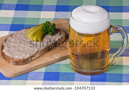 Bread with liverwurst and a glass of beer