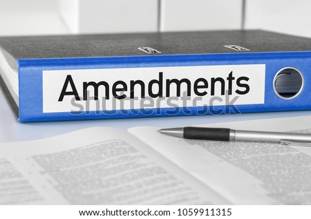 A blue folder with the label Amendments Foto stock © 