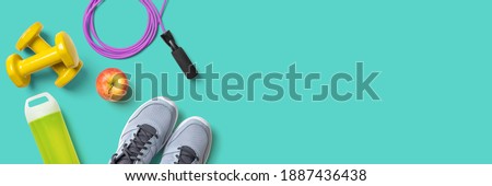 Fitness equipment on a turquoise background with copyspace Photo stock © 