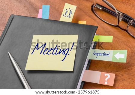 Planner with sticky note - Meeting