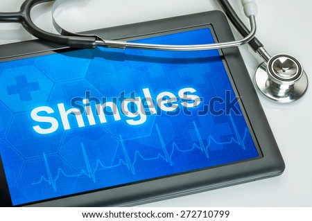 Tablet with the diagnosis Shingles on the display