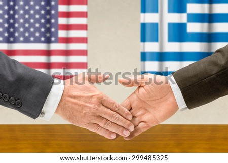 Representatives of the USA and Greece shake hands