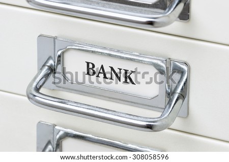 A drawer cabinet with the label Bank