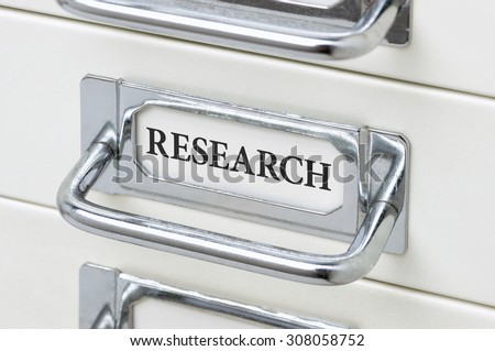 A drawer cabinet with the label Research
