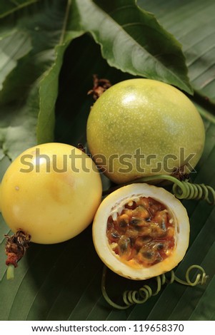 Exotic tropical fruits Passion fruit/ Marakuja/ lilikoi  on a tropical leaf. Hawaii, Maui, USA