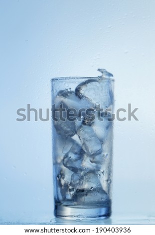 Glass of water with ice cubes  isolated on white background