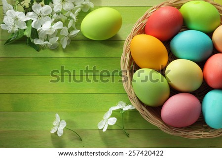 Painted Easter eggs basket and cherry blossom flowers